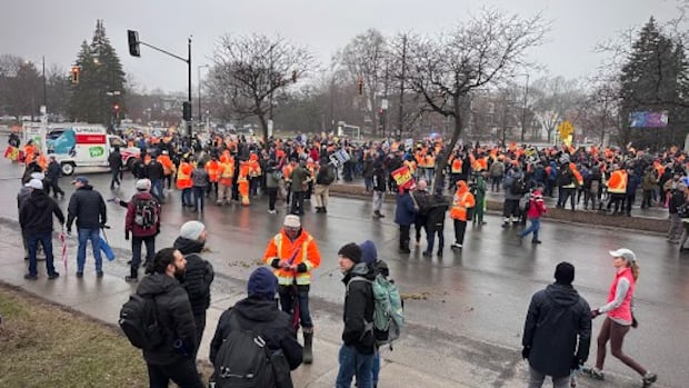 Striking Montreal blue-collar workers block part of Sherbrooke Street E. during rush hour