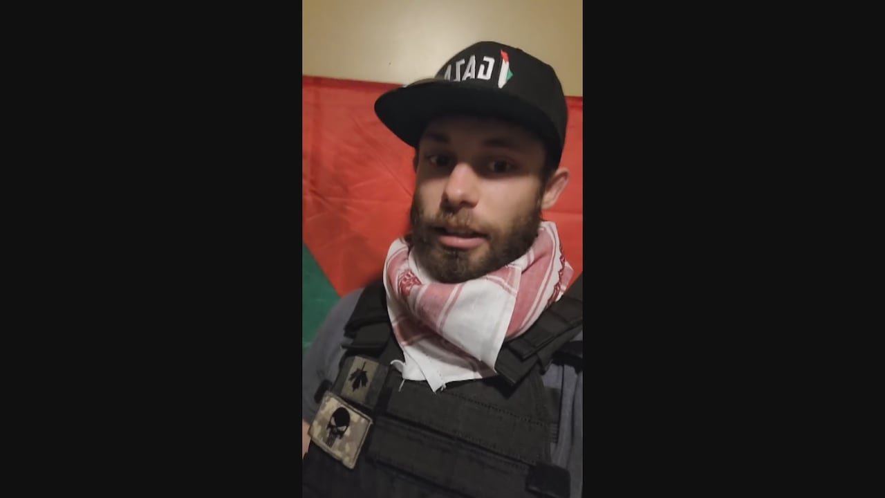 Nicholas Amor can be seen in a screengrab from a Facebook video he posted wearing a vest with an upside down Canadian flag.