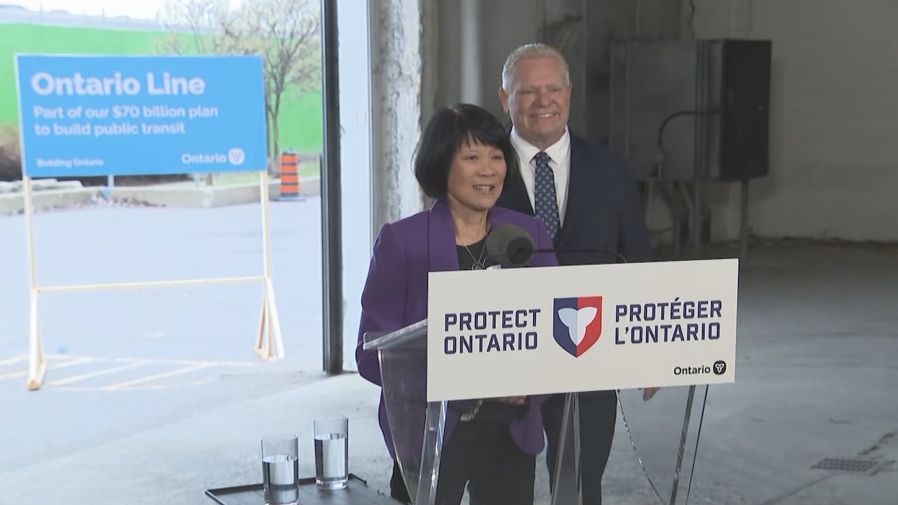 Man and woman at a podium that reads "Protect Ontario"