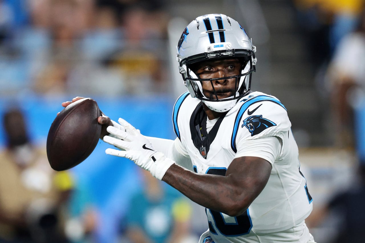 A quarterback rears back to throw a football.