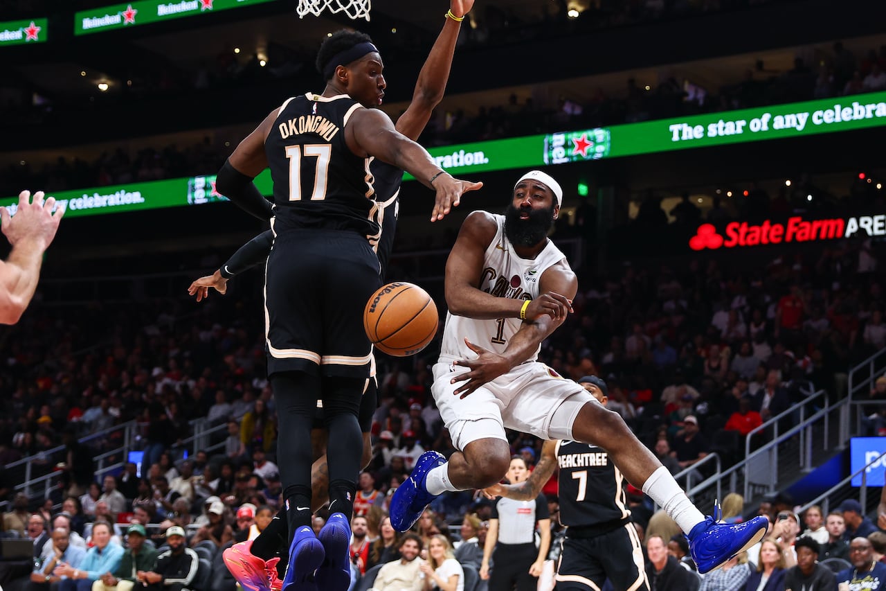 James Harden of the Cleveland Cavaliers makes a pass around Onyeka Okongwu of the Atlanta Hawks during an April 2026 game
