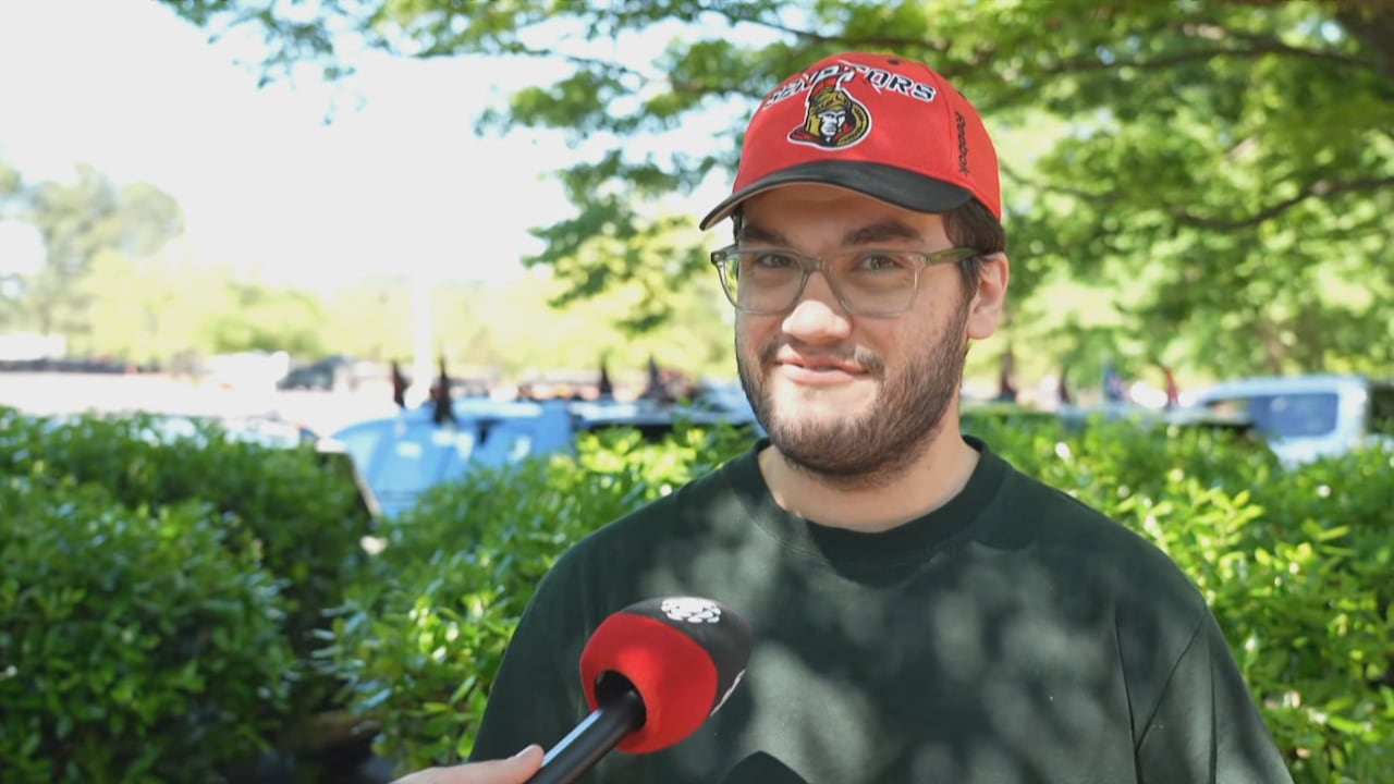 A man with a Senators ball cap.