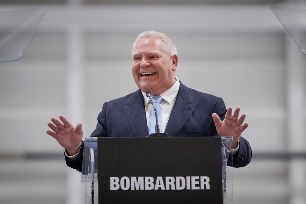Ford smiling at a podium