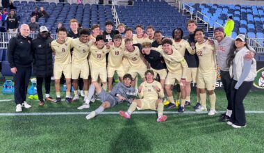 Men's Soccer celebrating goal against Northeastern