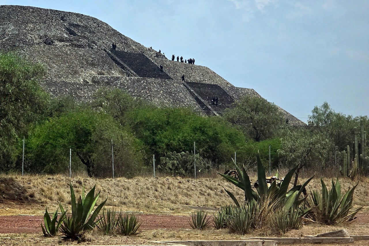 A distant view of police working at Mexico's Pyramid of the Moon following a shooting