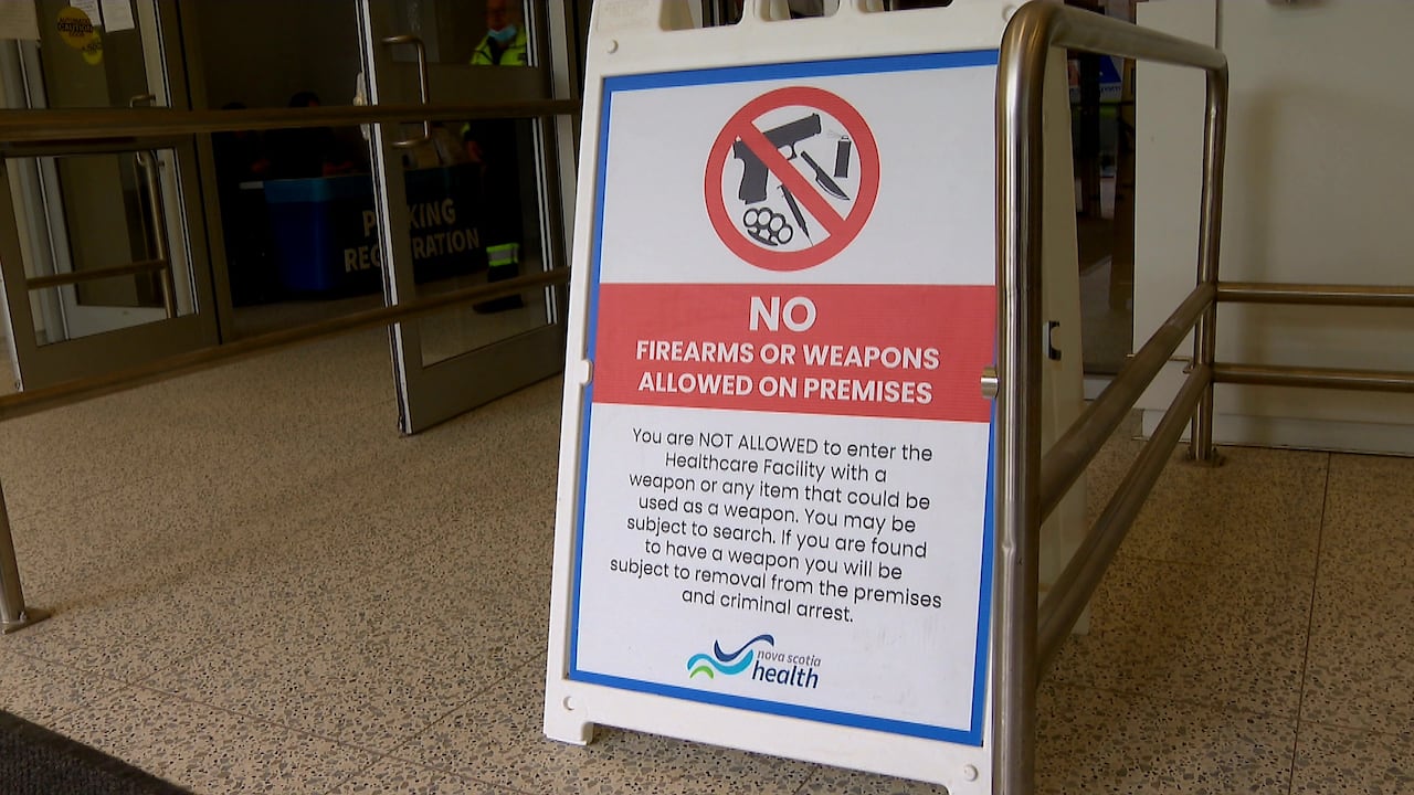 A sign warns people that they will not be able to enter the hospital with weapons or items that could be used as a weapon.