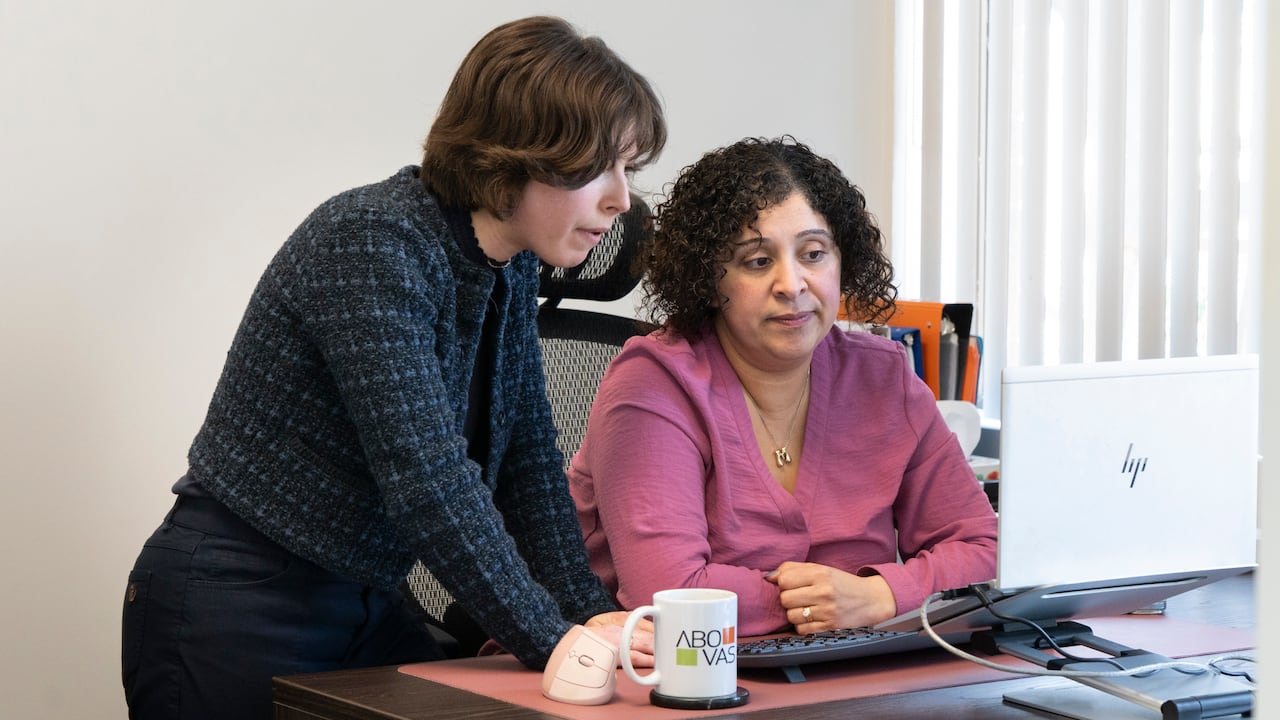 two people over a computer