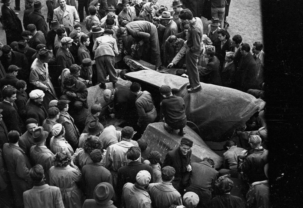 Crowd on top of Stalin monument during the Hungarian Revolution, Hungary