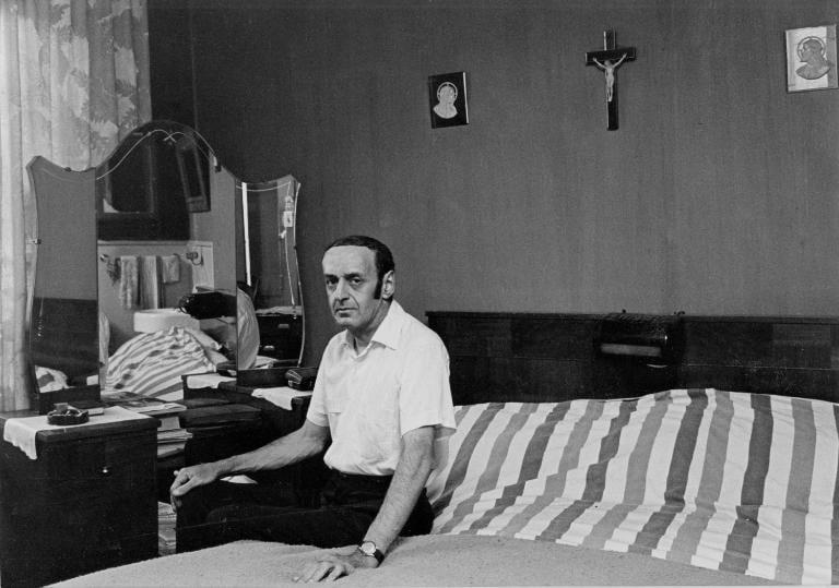 man in his bedroom