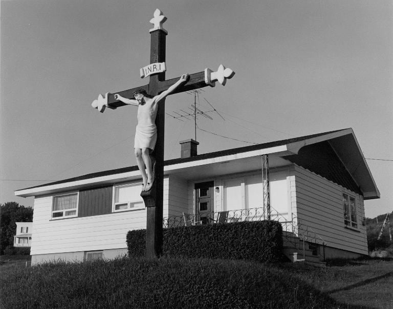 crucifix in front of house