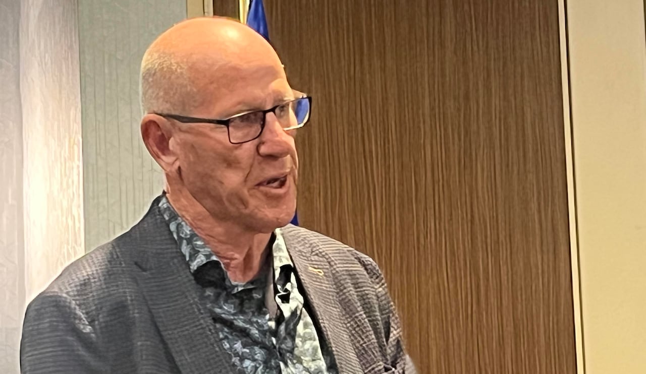 A man gestures as he speaks