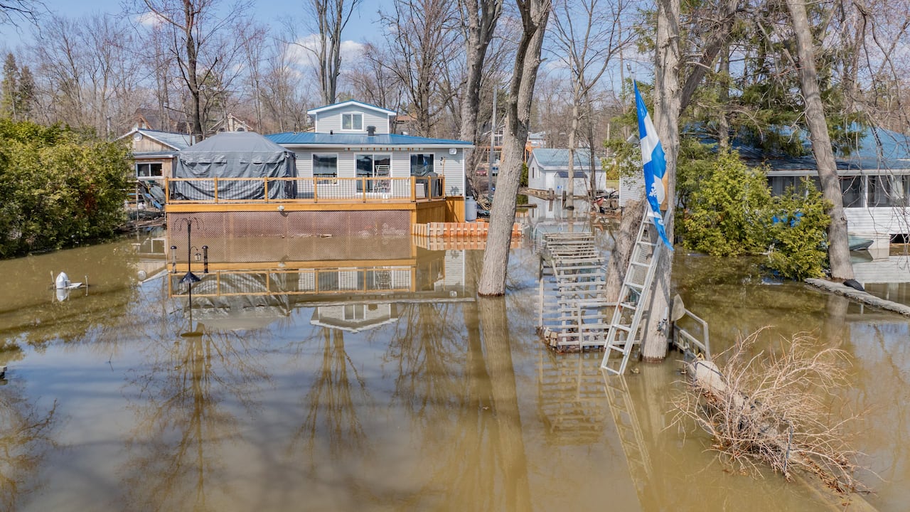 This photo, taken Wednesday by CBC, captures flooding in the area of Avenue des Tourterelles along the north Ottawa River shore, west of Gatineau, Que.
