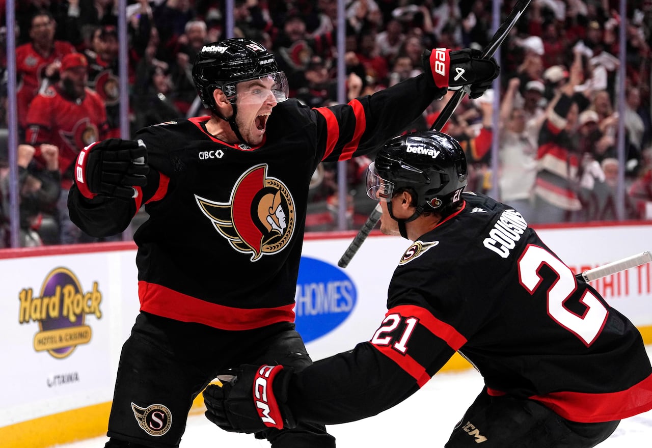 Hockey players celebrating a goal