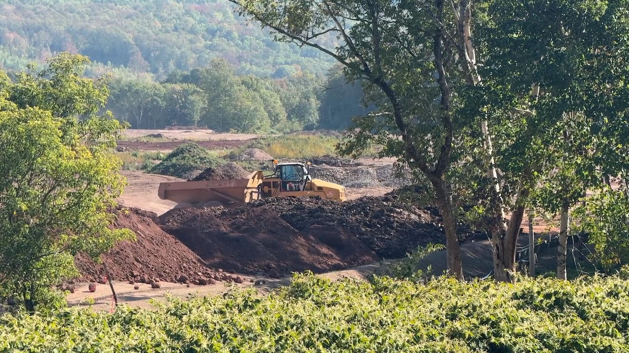a dump truck moves dirt 