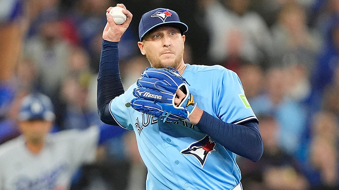 Blue Jays relief pitcher Jeff Hoffman throws to first base to get out Los Angeles Dodgers third baseman Max Muncy during an April 8, 2026 MLB regular-season game at Rogers Centre in Toronto.