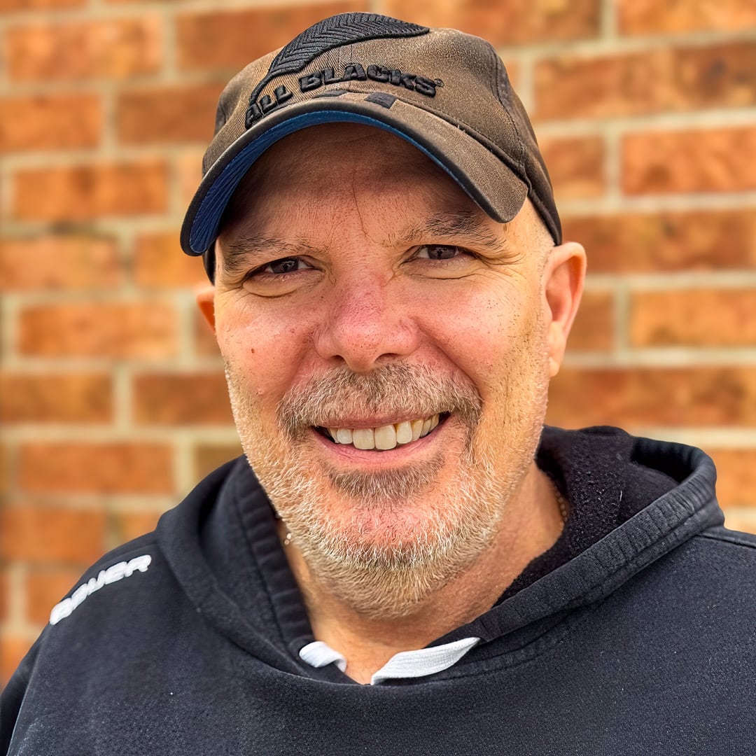 Man wearing a baseball hat.