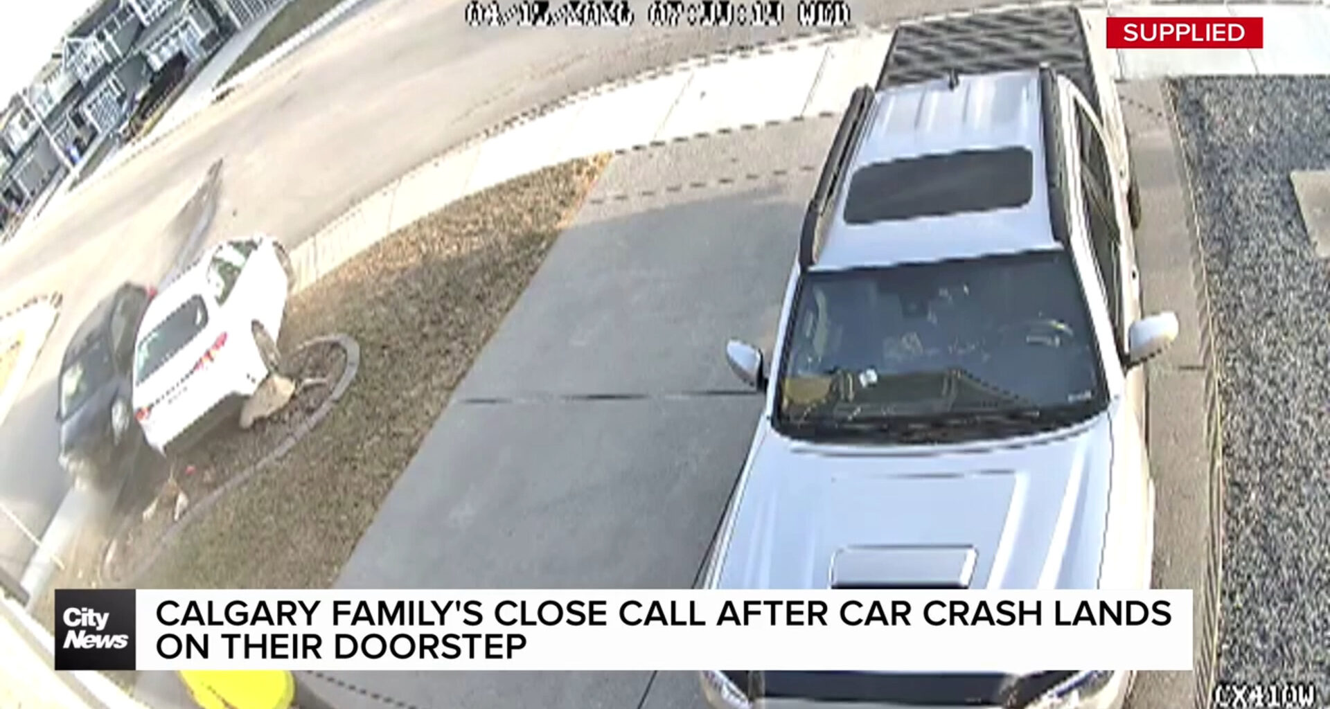 Calgary family's close call after car crash lands on their doorstep
