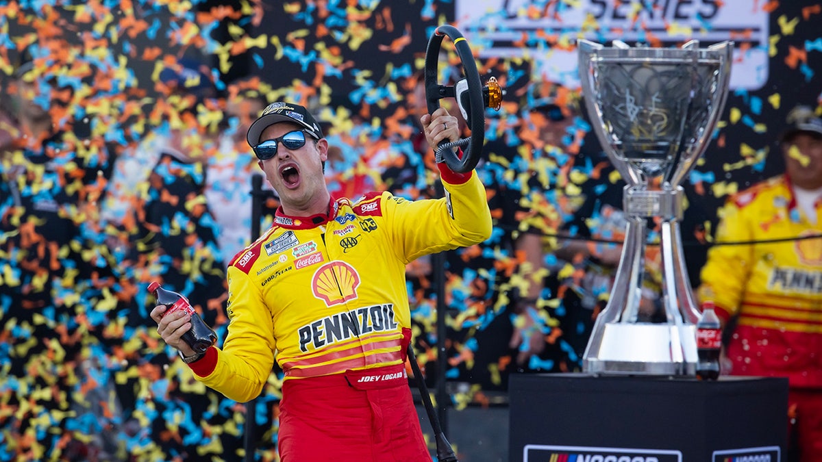 NASCAR Cup Series driver Joey Logano celebrating victory at Phoenix Raceway