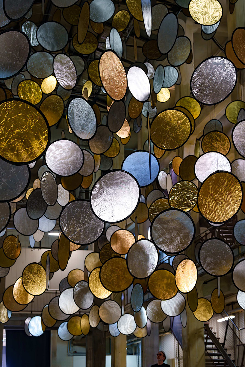 SpY’s kinetic installation suspends rotating gold and silver halos inside florence atrium - 5