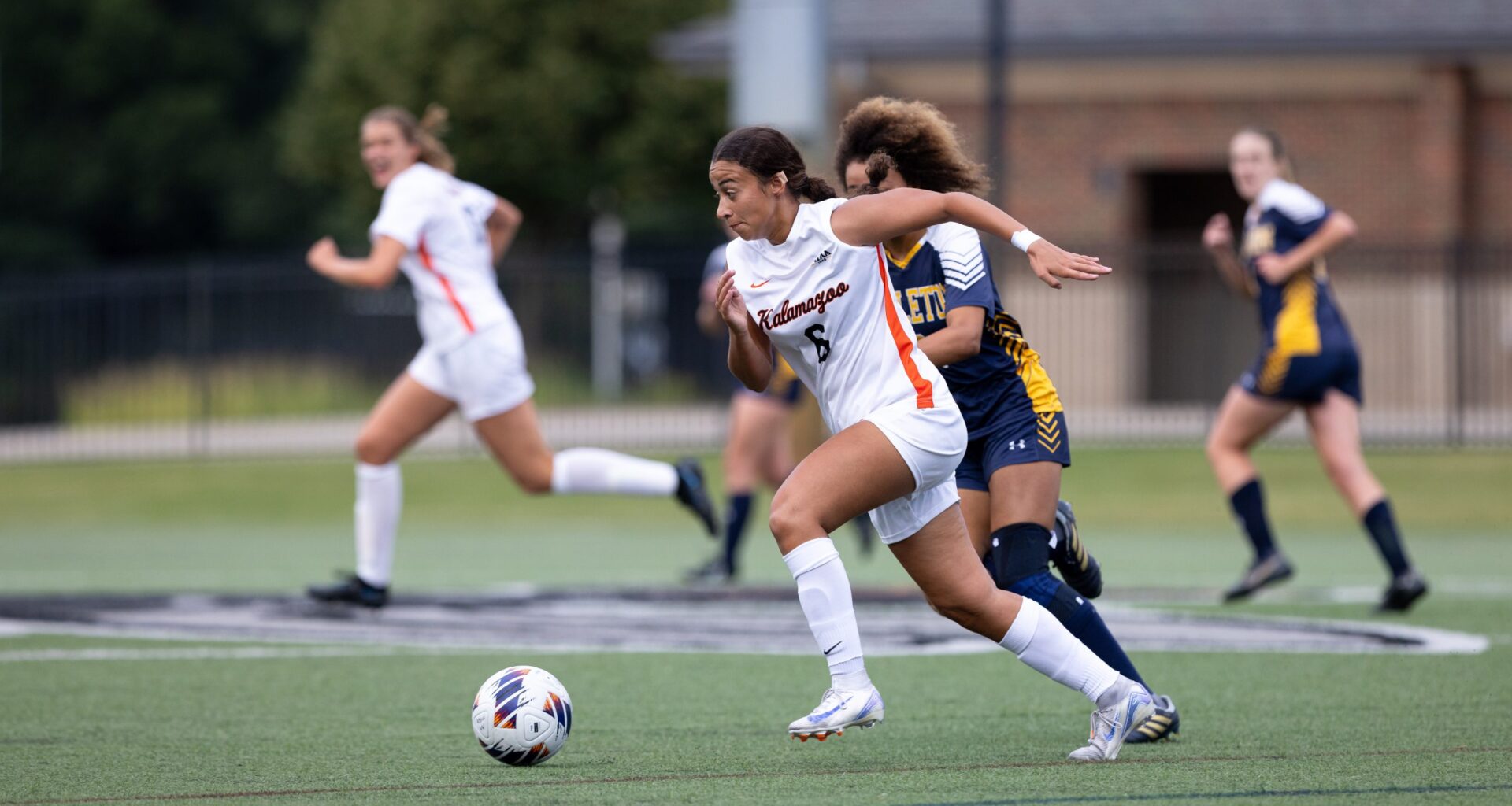 Miyani Sonera driving downfield during a Kalamazoo College women