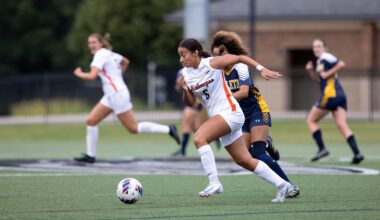 Miyani Sonera driving downfield during a Kalamazoo College women