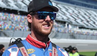 An image of Cleetus McFarland smiling on pit road at Daytona International Speedway