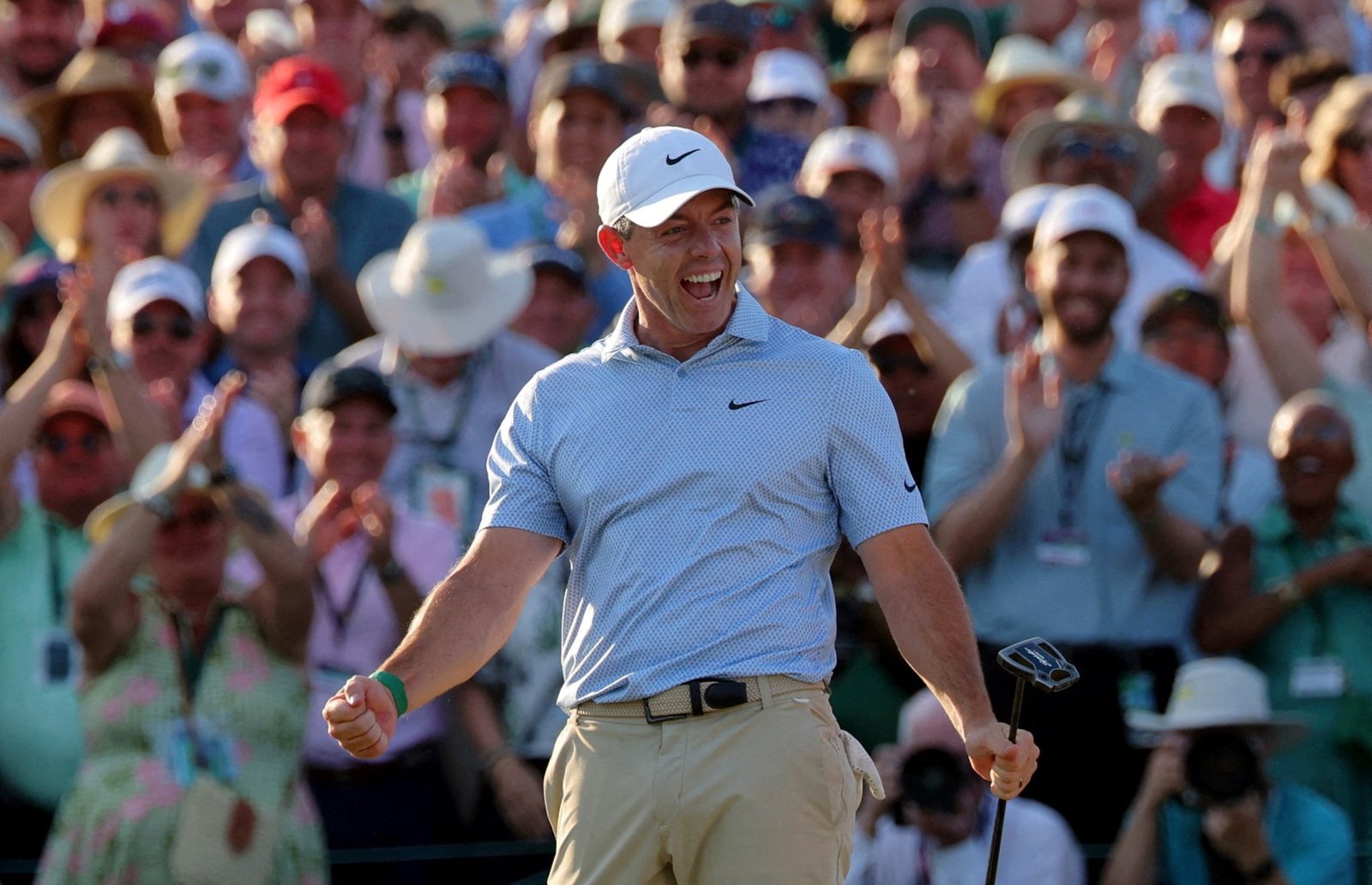 McIlroy celebrates victory on the 18th green
