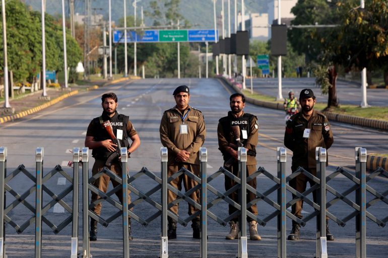 Police officers stand guard behind a barricade near Serena Hotel, as Pakistan prepares to host the U.S. and Iran for the second round of peace talks, in Islamabad, Pakistan, April 25, 2026. REUTERS/Asim Hafeez