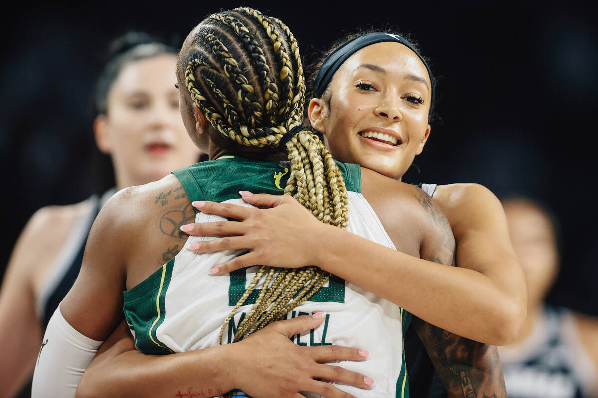 Aces guard Aaliyah Nye hugs former Aces guard Tiffany Mitchell during game one of a first round ...