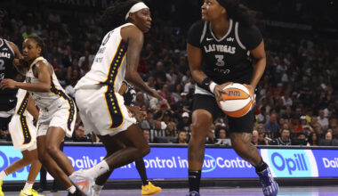Aces forward NaLyssa Smith (3) looks to shoot against Indiana Fever forward Natasha Howard (6) ...