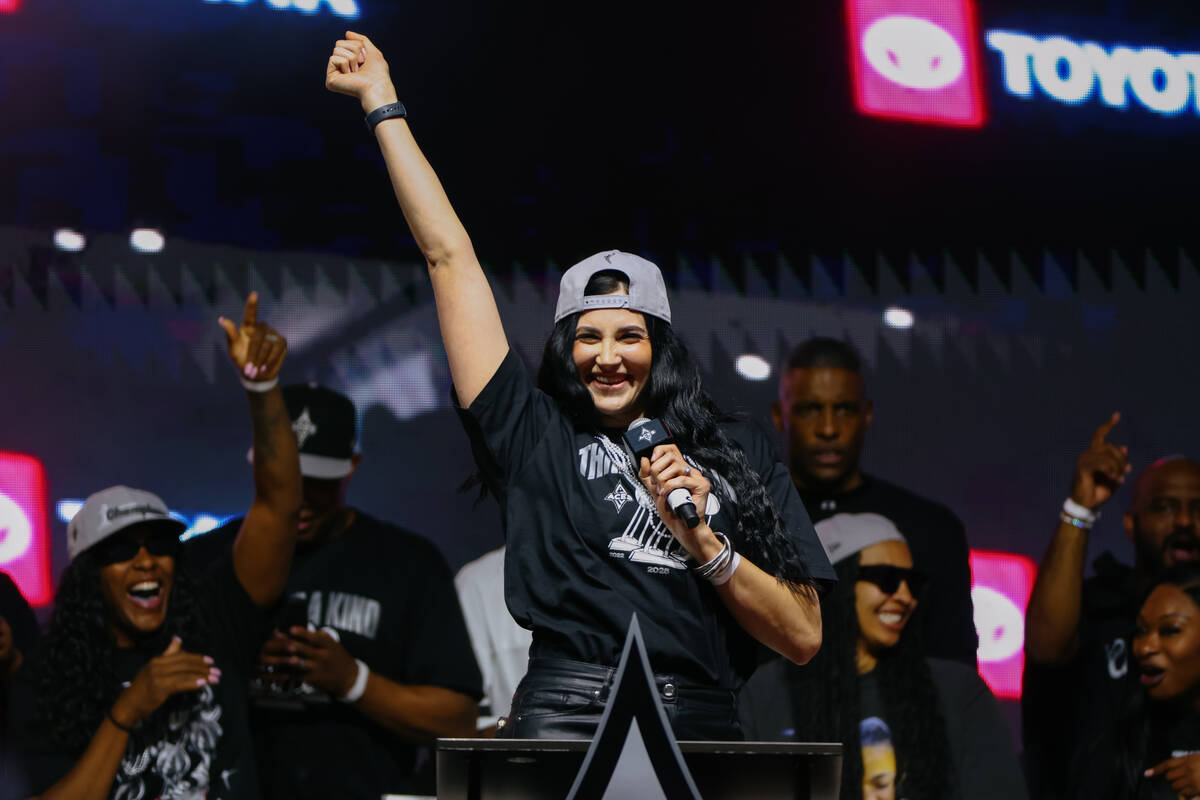 Aces center Megan Gustafson walks up to the podium to make some remarks during the Aces’ ...