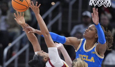 UCLA forward Janiah Barker (0) blocks a Southern California guard JuJu Watkins (12) shot during ...