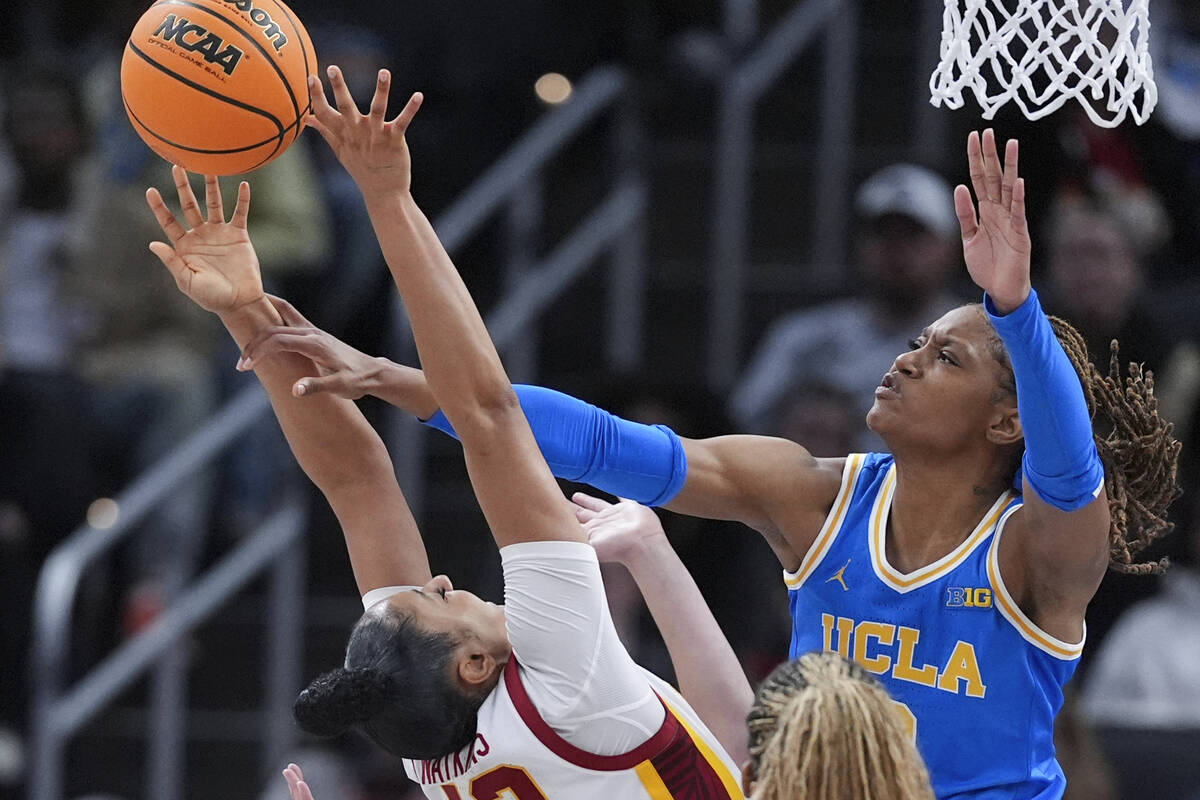 UCLA forward Janiah Barker (0) blocks a Southern California guard JuJu Watkins (12) shot during ...