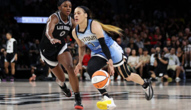 Chicago Sky guard Chennedy Carter (7) dribbles up the court against Las Vegas Aces guard Jackie ...
