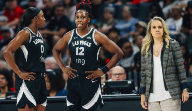Aces guard Jackie Young (0) and guard Chelsea Gray (12) talk during a free throw next to head c ...