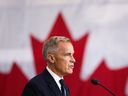 Canadian Prime Minister Mark Carney speaks as he attends a tour of the Fort York Armoury in Toronto on June 9, 2025 in Toronto, Canada.   
