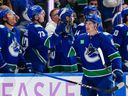 Vancouver Canucks winger Drew O'Connor is congratulated after scoring against the Columbus Blue Jackets on Nov. 18 at Rogers Arena. He leads his club with 10 goals at home.