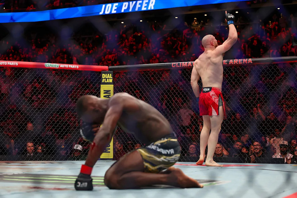 SEATTLE, WASHINGTON - MARCH 28: Israel Adesanya (L) recovers as Joe Pyfer celebrates victory after their UFC middleweight bout during UFC Fight Night at Climate Pledge Arena on March 28, 2026 in Seattle, Washington. (Photo by Mat Hayward/Getty Images)