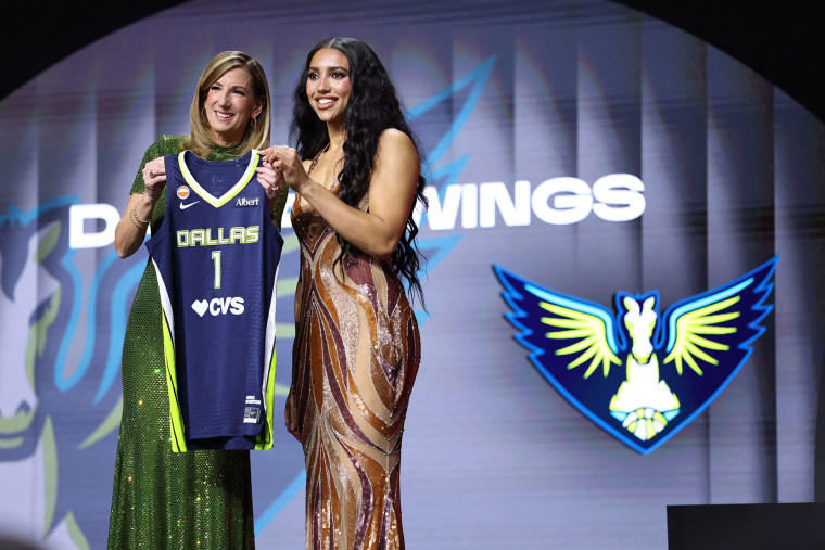 WNBA Commissioner Cathy Engelbert poses for a photo with Azzi Fudd after being drafted first overall by the Dallas Wings during the 2026 WNBA draft on April 13, 2026 at The Shed in New York