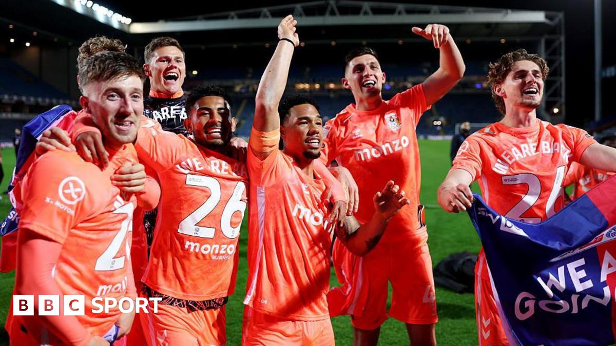 Coventry City players celebrate promotion to the Premier League at Blackburn Rovers