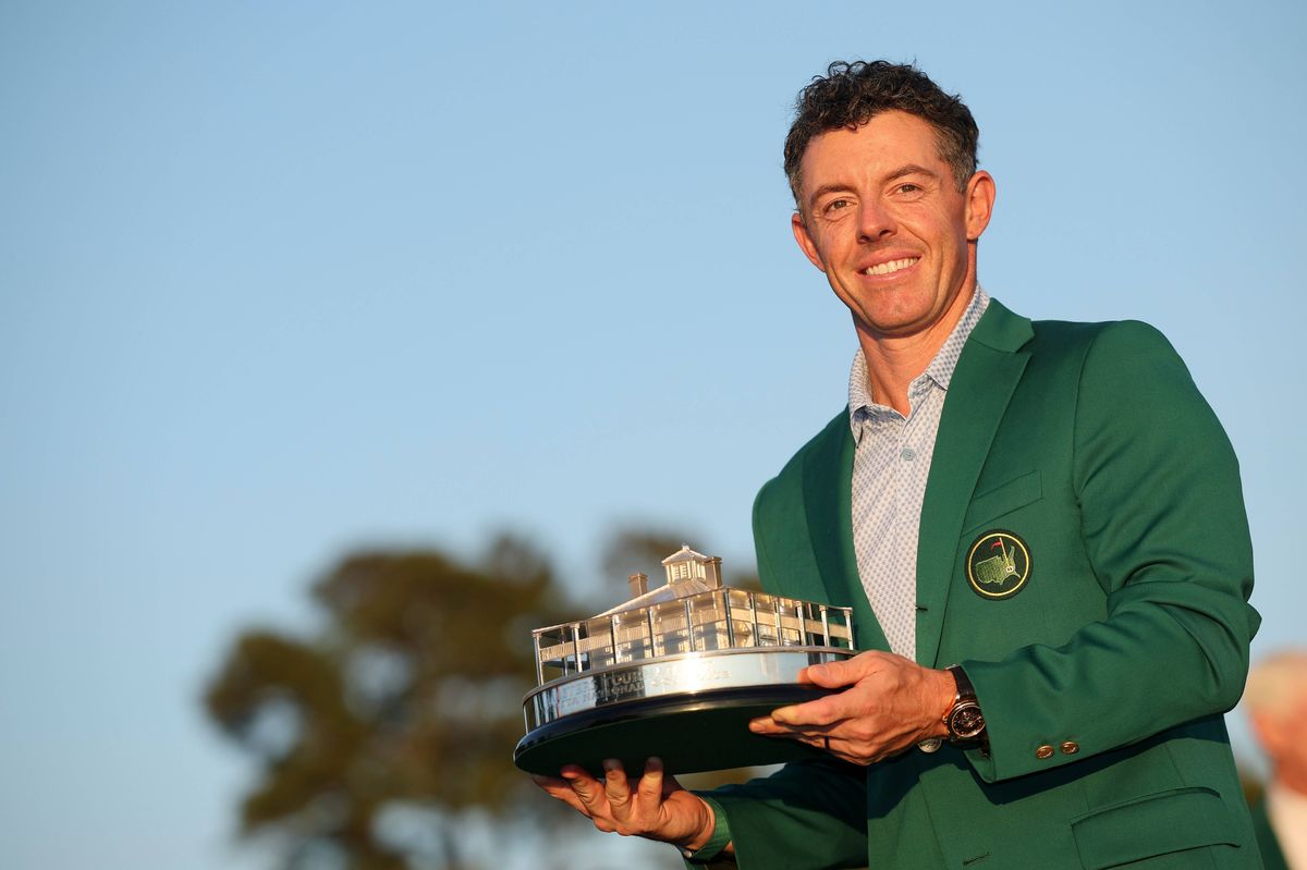 Rory McIlroy poses with the Masters trophy