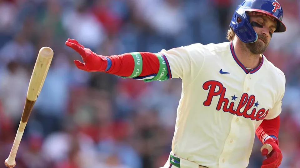 Bryce Harper tosses his bat after hitting a home run. He's hit 57 HR the last two seasons. Bill Streicher-Imagn Images