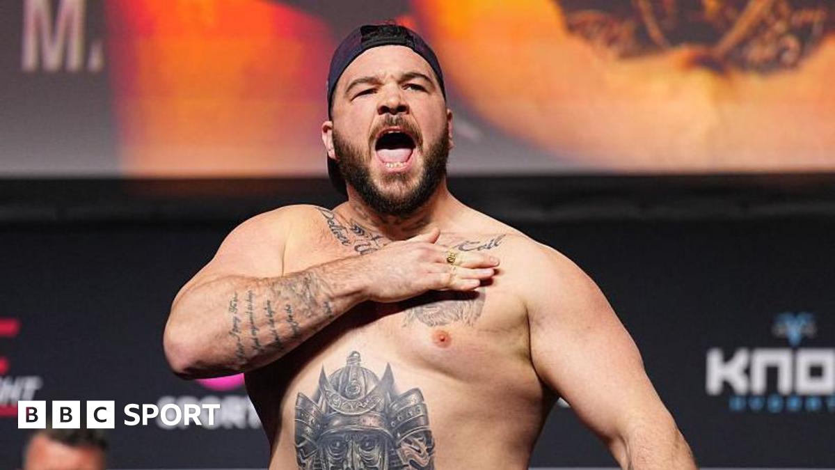 Louie Sutherland slaps his chest as he weighs in