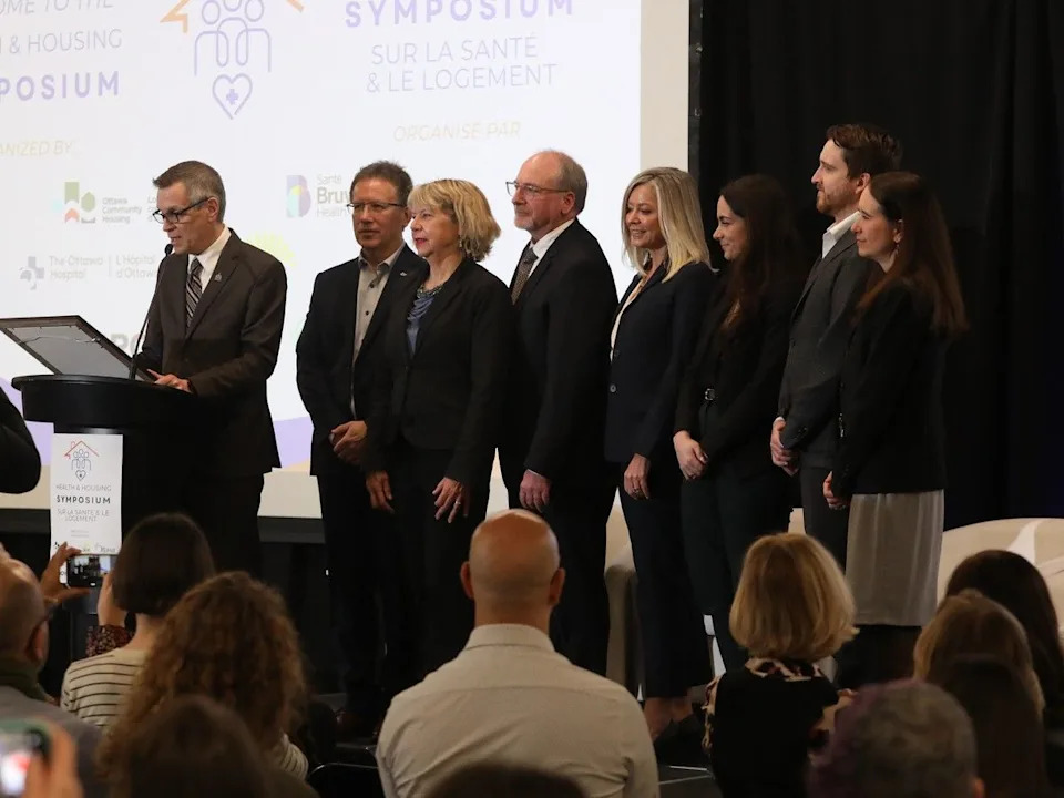 Mayor Mark Sutcliffe reads a proclamation during the Ottawa Health and Housing Symposium on Friday, April 10.