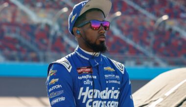 An image of NASCAR driver Rajah Caruth in Hendrickcars.com gear