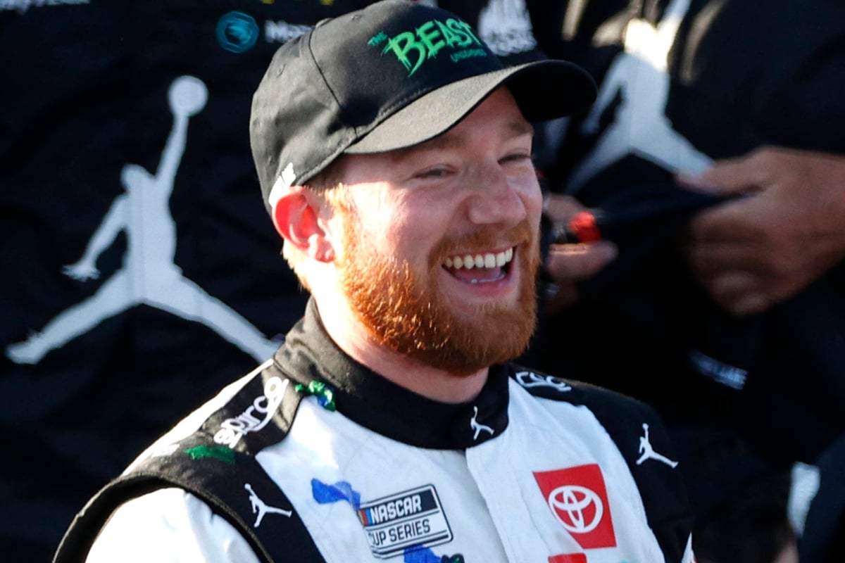 An image of NASCAR driver Tyler Reddick celebrating a race win
