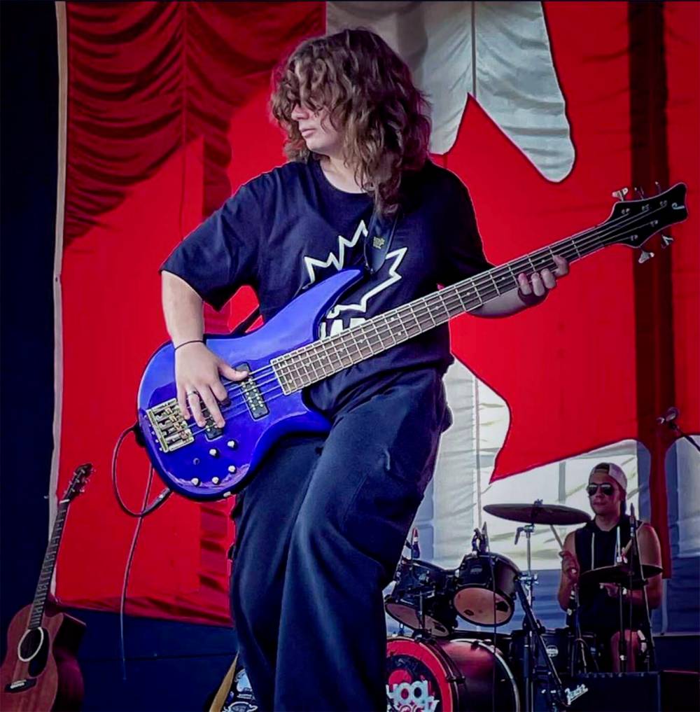 SUPPLIED
School of Rock student Desneige Ketcheson rocks out in Assiniboine Park on Canada Day with the house band.