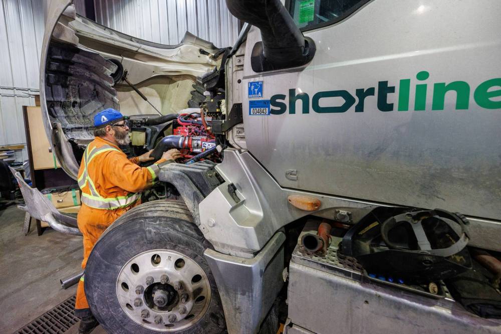 MIKE DEAL / FREE PRESS
James, a mechanic at Shortline Moving Solutions Inc., works on one of the company vehicles.