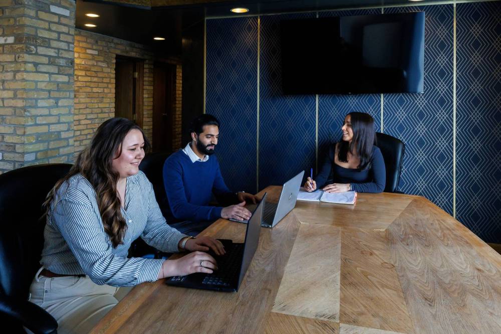 MIKE DEAL / FREE PRESS
From left: Taylor Erlendson, Operations Manager, Adnan Arshad, Logistic and Operations Supervisor, and Olivia Renaud, Customer Success Manager during a meeting in the Shortline boardroom.