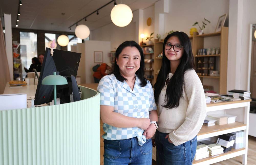Ruth Bonneville / Free Press
Papiiro owner Cay Iledan, with daughter Zoe, at the recently opened stationary store at 109 Osborne St.